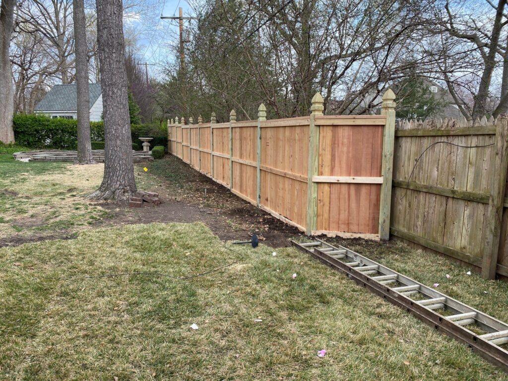 New wooden fence installation
