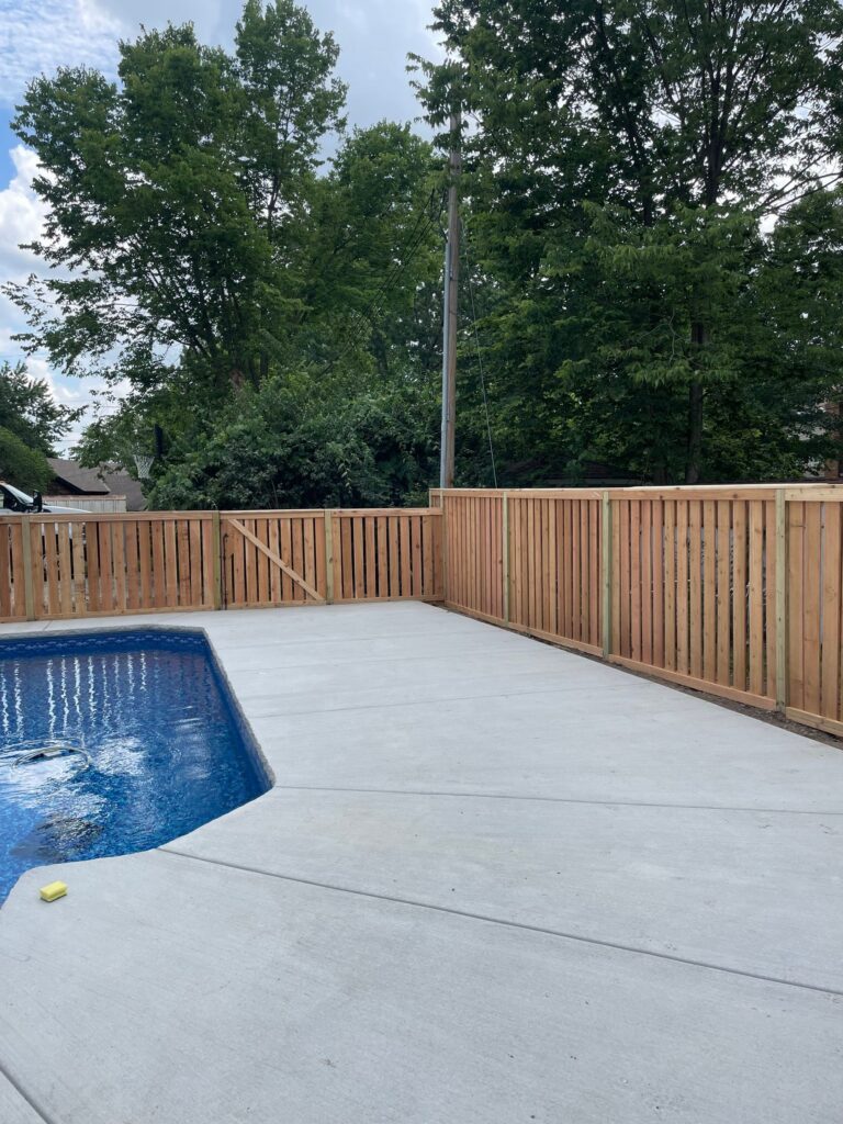 New wooden fence around pool